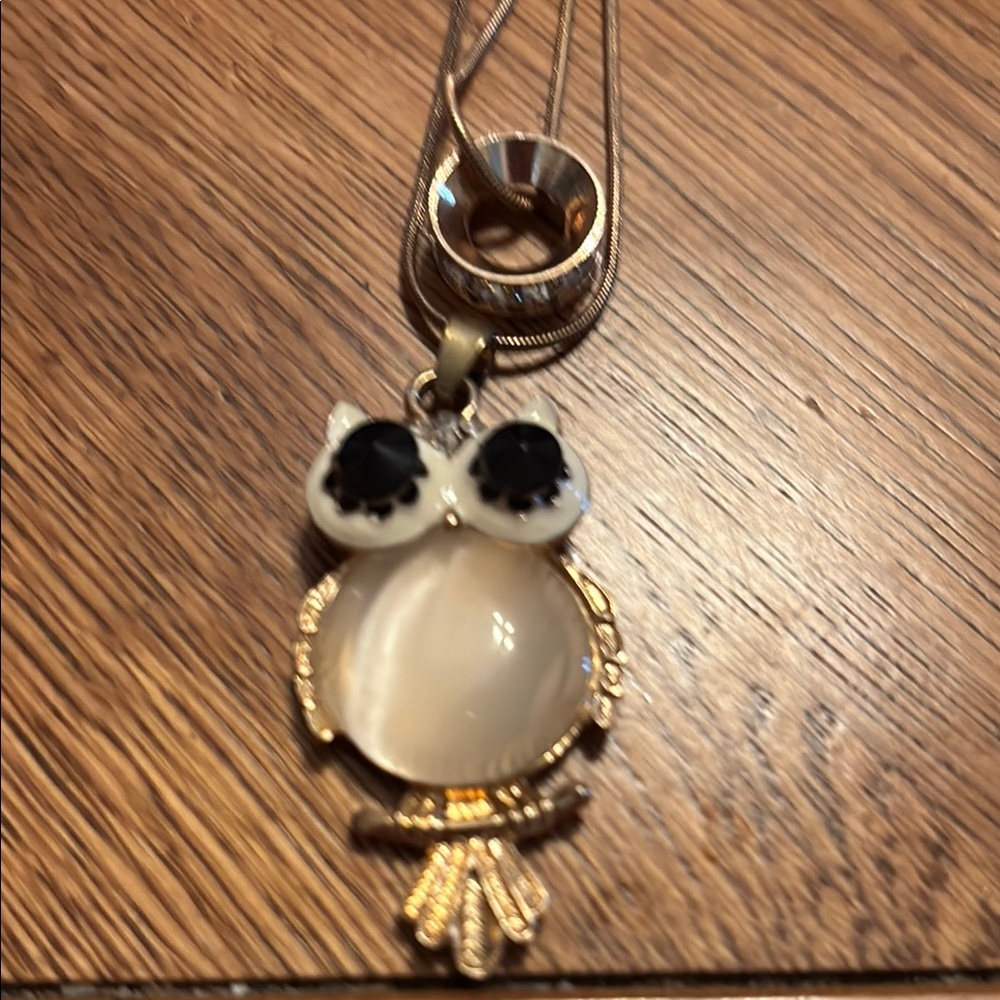 Cute double necklace, cute owl and circle. Approximately 28” Goldtone